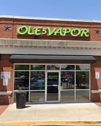 Ole 5 Vapor storefront — green sign over suite 103 off Old Highway 5